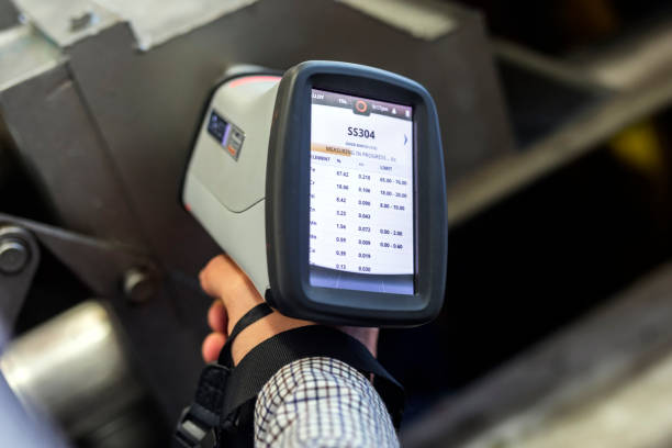 The inspector is material analysis (pmi and xrf) is measuring in stainless steel (ASTM A 304-SS304 material) with digital portable material analyzer. The inspector is material analysis (pmi and xrf) is measuring in stainless steel (ASTM A 304-SS304 material) with digital portable material analyzer. x ray plates stock pictures, royalty-free photos & images