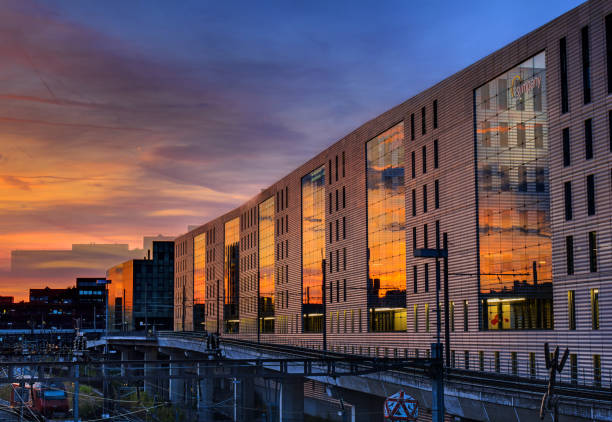 The Jacob Burckhardt Building in the golden hour with afterglow reflected on the glass facade stock photo