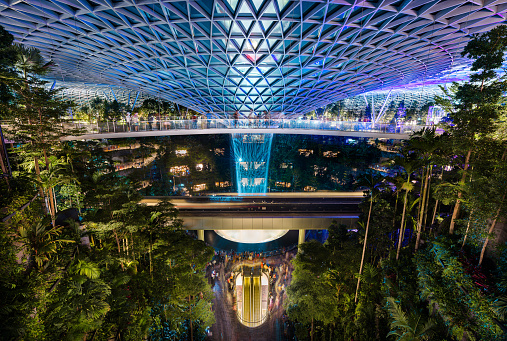 Singapore - 8 Sep 2019: The Jewel Changi is the last architectural addition to the Singapore airport, with record high indoor rain vortex waterfall, a vertical tropical forest and a shopping mall under a glass dome.