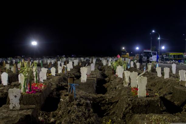 The Keputih Cemetery Complex is one of the largest Covid-19 graves at Surabaya stock photo
