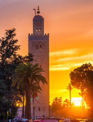 The Koutoubia Mosque at sunset with shot from Jamaa el-Fnaa square in the Marrakech district of the medina. Perfect shot for travel, holidays and vacations.