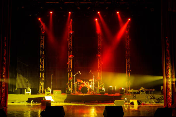 The light of searchlights in smoke on stage. stock photo