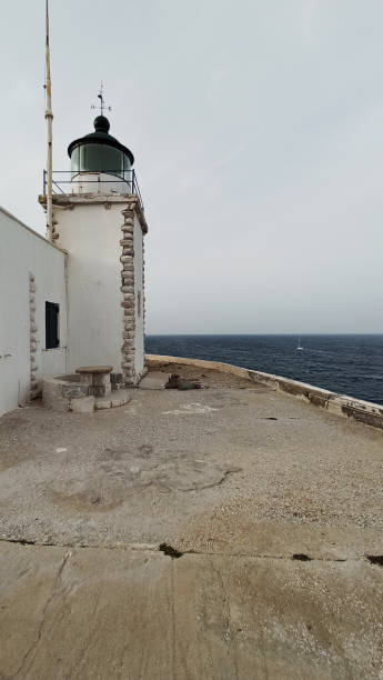 The lighthouse Vrisaki at Lavrion, Attica, Greece stock photo
