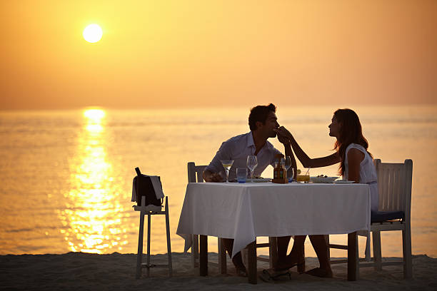 the love of his life - sunset dining stockfoto's en -beelden