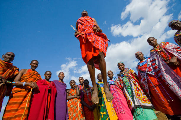 The man of a tribe Masai shows ritual jumps. stock photo