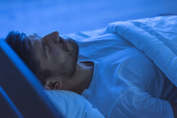 The man sleeping in the bed. night time stock photo
