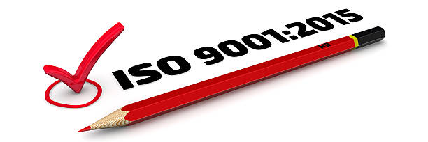 ISO 9001:2015. The Mark The mark "ISO 9001:2015". Red pencil and mark on white surface 2015 stock pictures, royalty-free photos & images