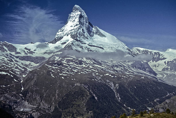 The Matterhorn The Matterhorn (14,692') in the Pennine Alps on the border between Switzerland and Italy is probably one of the most recognizable mountains in the world. This picture was taken from the beautiful meadows above the town of Zermatt in Valais Canton in Switzerland. jeff goulden switzerland stock pictures, royalty-free photos & images