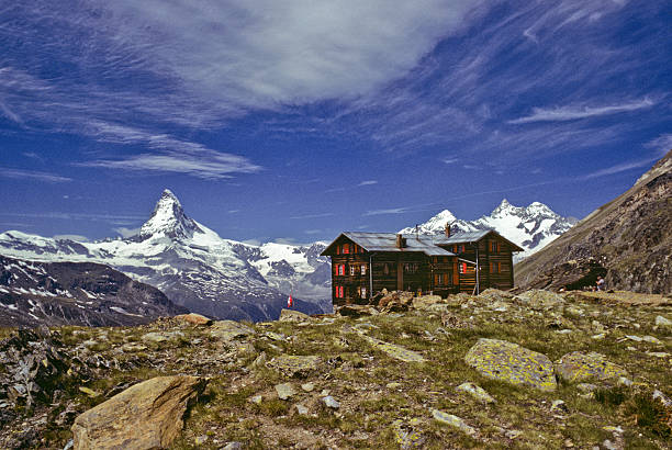 The Matterhorn and Restaurant at Fluhalp The Matterhorn (14,692') in the Pennine Alps on the border between Switzerland and Italy is probably one of the most recognizable mountains in the world. This picture was taken from the beautiful Fluhalp meadows above the town of Zermatt in Valais Canton in Switzerland. jeff goulden switzerland stock pictures, royalty-free photos & images