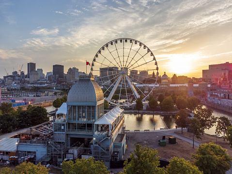 La Grande roue de Montreal Ferris wheel and downtown skyline in summer dusk. Quebec, Canada.