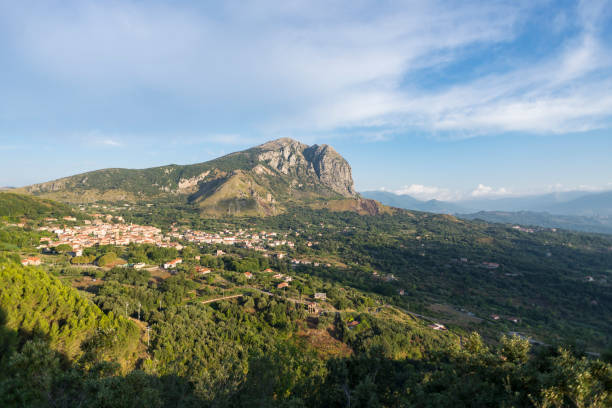 The mountain range of Monte Bulgheria and the township of San Giovanni a Piro in Cilento in the morning sun stock photo