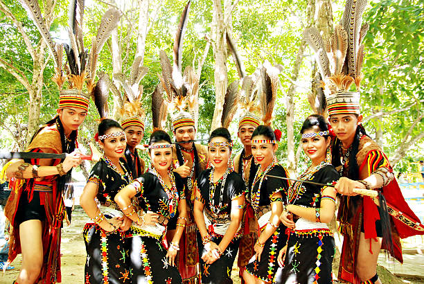The Murut beauties and hunters Tambunan, Sabah Malaysia - May 1, 2015 : A sllightly blurr image of a group of dancers in Murut traditional costumes posing before performing at the Sabah Harvest Festival opening ceremony on May 1, 2015, Tambunan. asian beauties stock pictures, royalty-free photos & images