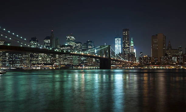The New York City skyline w Brooklyn Bridge stock photo