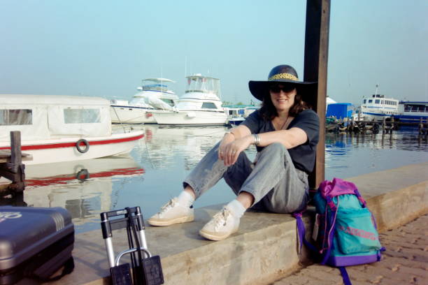 The nineties.  Waiting at the marina for the transfer to Thousand Islands. Jakarta, Indonesia. stock photo