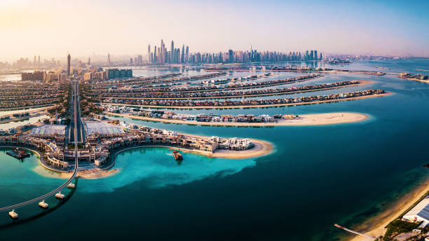 The Palm island panorama with Dubai marina in the background aerial The Palm island panorama with Dubai marina rising in the background aerial view vacation rental photos stock pictures, royalty-free photos & images