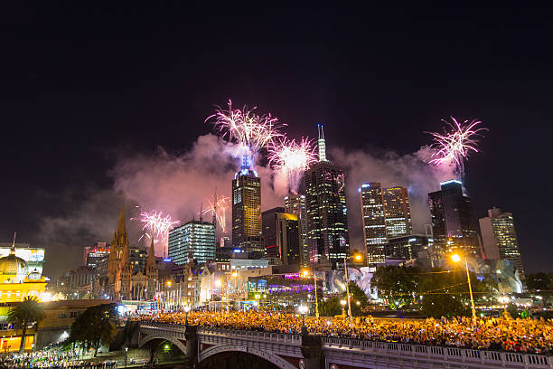 The passing of the old year New Year's Eve Fireworks 2013 in Melbourne, Australia with St Paul's Cathedral and Princes Bridge. federation square stock pictures, royalty-free photos & images