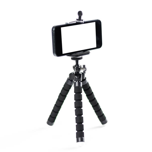 the phone on the tripod. close up. isolated on white background - smartphone filming imagens e fotografias de stock