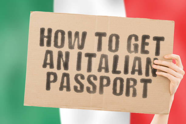 The phrase " How to get an Italian passport " on a banner in men's hand. Legislation. Law. Government. Power. Recognition. Personality. Citizenship. Document The phrase " How to get an Italian passport " on a banner in men's hand. Legislation. Law. Government. Power. Recognition. Personality. Citizenship. Document immigration documents in italy stock pictures, royalty-free photos & images