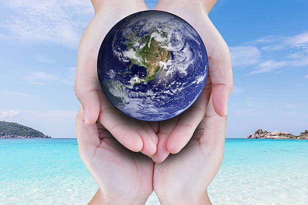 the planet among human hands in concept Healthy oceans healthy...