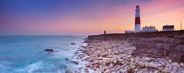 The Portland Bill Lighthouse in Dorset, England at sunset stock photo