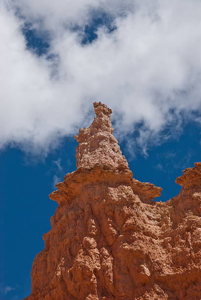 The Queen Bryce Canyon is famous for its tall thin spires of rock known as hoodoos. Hoodoos start with an initial deposition of rock. Then over time the rock is uplifted then eroded and weathered. Hoodoos typically consist of relatively soft rock topped by harder, less easily eroded stone that protects each column from the weather. Hoodoos generally form within sedimentary rock such as sandstone. These hoodoos were photographed from the Queen's Garden Trail in Bryce Canyon National Park, Utah, USA. garfield county utah stock pictures, royalty-free photos & images