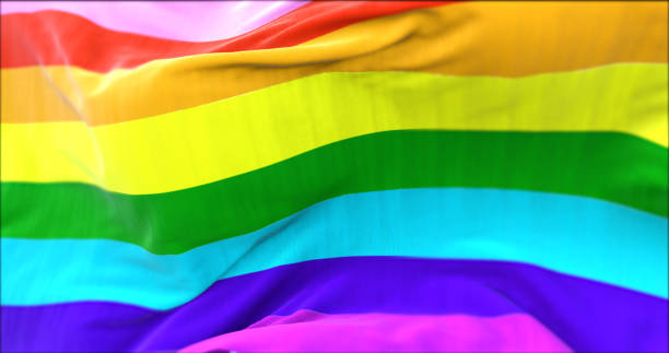 la bandera arco iris ondeando en el viento. - nyc pride parade fotografías e imágenes de stock