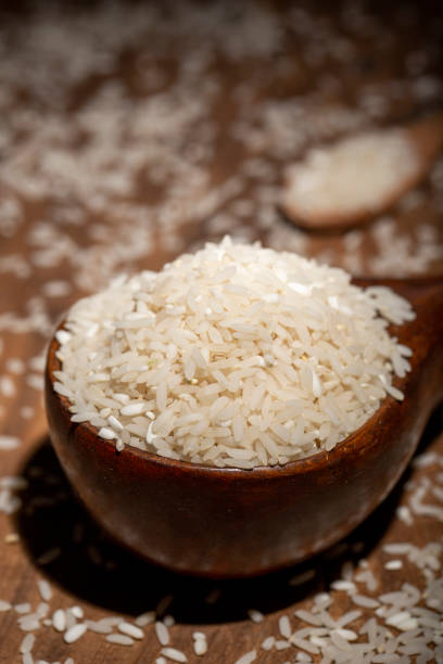The rice is on the wooden table stock photo