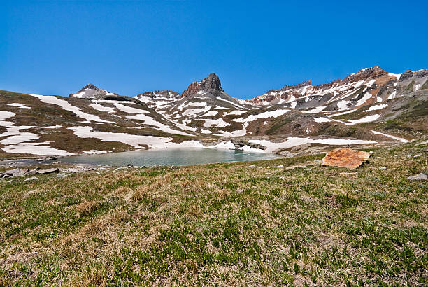 Golden Horn Above Upper Ice Lake Basin The San Juans in southern Colorado are a high altitude range of mountains that straddle the Continental Divide. This wide-open landscape, at 12,300, is well above timberline. The photograph was taken from Upper Ice Lake in the San Juan National Forest near Silverton, Colorado, USA. jeff goulden san juan mountains stock pictures, royalty-free photos & images