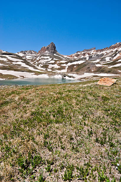 Golden Horn Above Upper Ice Lake Basin The San Juans in southern Colorado are a high altitude range of mountains that straddle the Continental Divide. This wide-open landscape, at 12,300, is well above timberline. The photograph was taken from Upper Ice Lake in the San Juan National Forest near Silverton, Colorado, USA. jeff goulden san juan mountains stock pictures, royalty-free photos & images