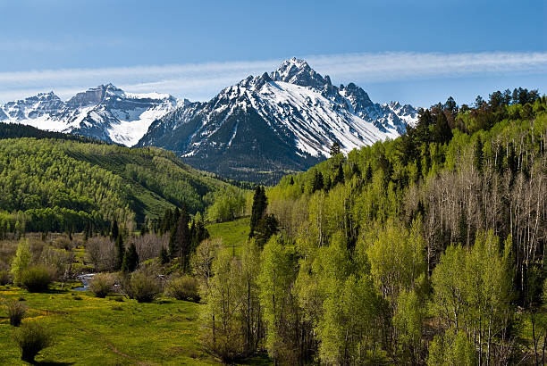 Mount Sneffels The San Juans in southern Colorado are a high altitude range of mountains that straddle the Continental Divide.  The snow capped Mount Sneffels was photographed from the Dallas Creek Valley in the Uncompahgre National Forest near Ridgway, Colorado, USA. jeff goulden mountain stock pictures, royalty-free photos & images
