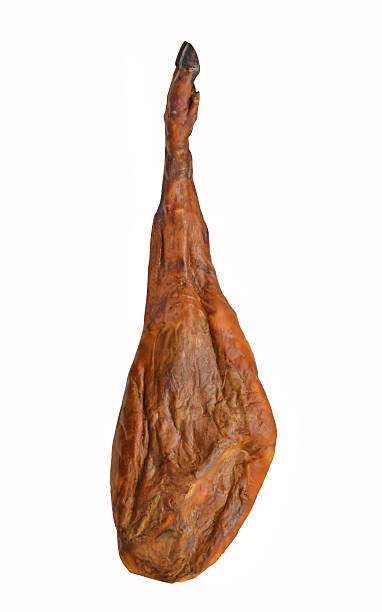 The serrano ham leg. Leg of Serrano ham isolated on white background. animal leg stock pictures, royalty-free photos & images
