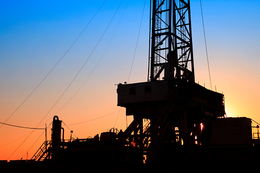 The Silhouette Of Oilfield Derrick Stock Photo - Download 