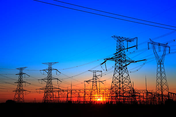 The silhouette of the evening electricity transmission pylon The silhouette of the evening electricity transmission pylon electricity pylon photos stock pictures, royalty-free photos & images