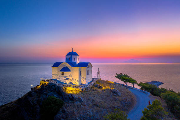 The small church of Agios Nikolaos at the entrance of the port on the island of Lemnos in Greece stock photo
