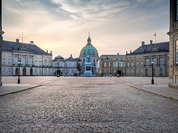 The square of Amalienborg Royal Palace . Copenhagen, Denmark, dawn Frederikskirken, or Marmorkirken, or Marble Church, seen from the Rococo Amalienborg Palads, Copenhagen, Denmark cobblestone stock pictures, royalty-free photos & images