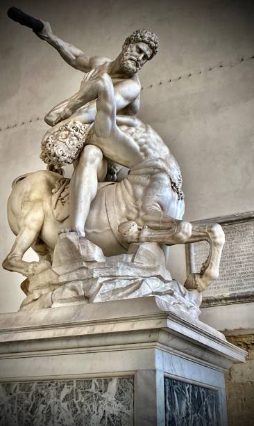 the statue of hercules killing the centaur nessus (1599) by giambologna (giovanni da bologna), located in the loggia dei lanzi florence, tuscany, italy. stock photo