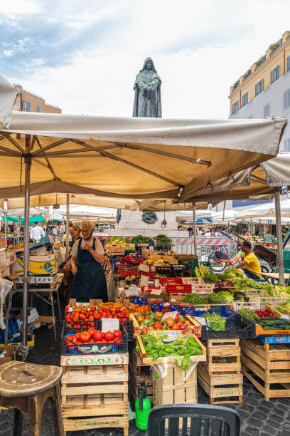 The suggestive and characteristic street market of Campo de Fiori in the heart of Rome stock photo