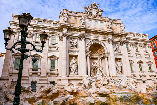 The suggestive and majestic facade of the Trevi Fountain, in the historic and baroque heart of Rome. Built in 1732 on the wishes of Pope Clement XII, the Trevi Fountain it's one of the masterpiece of the late Roman Baroque, recognized as one of the most beautiful and famous fountain in the world. Built on the facade of the Palazzo Poli by the architect Nicola Salvi, it was inaugurated in 1762. Image in High Definition format.
