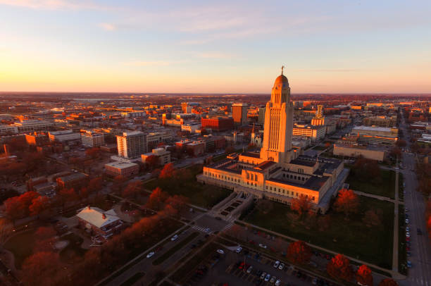 The sun sets over the State Capital Building in Lincoln Nebraska stock photo