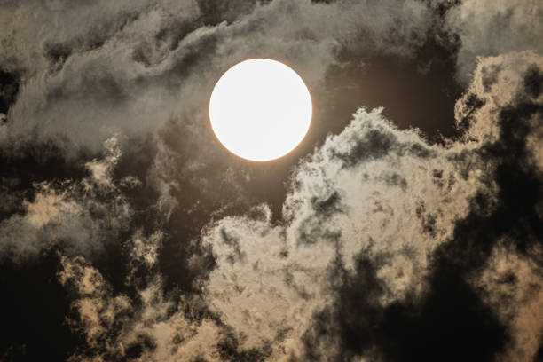 The sun with moving cloud stock photo