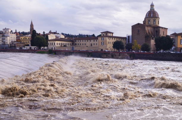 The swollen river Arno in Florence The swollen river Arno in Florence, Italy arno river stock pictures, royalty-free photos & images