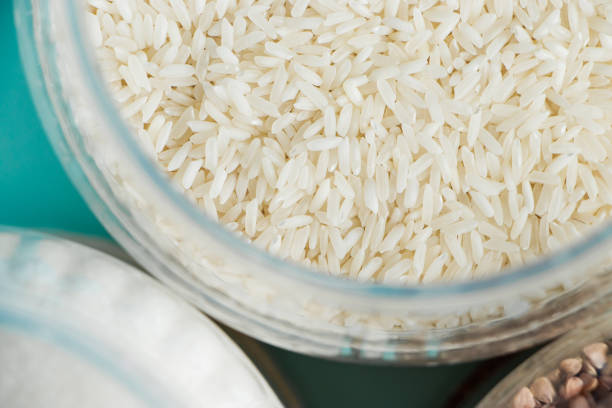 The texture of white rice close-up. Shortage of essential goods. stock photo