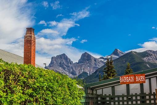 Сanmore Сanada - June 12, 2015: A store  with the Three Sisters summit in the city of Canmore  located near the southeast boundary of Banff National Park. 