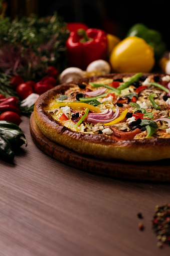 A perfect vegetable pizza on a wooden board