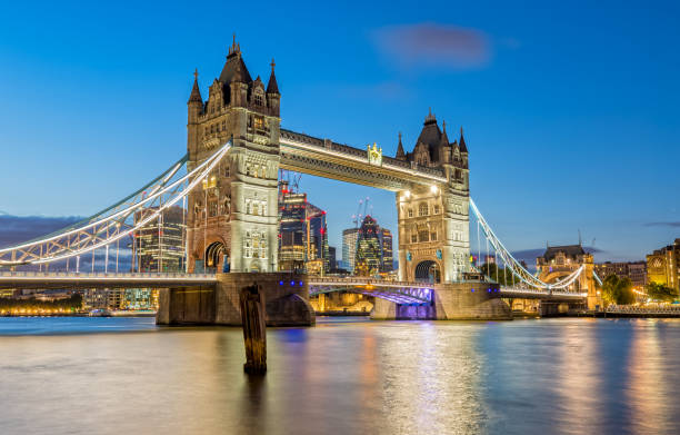 The Tower Bridge in London light up at Night stock photo