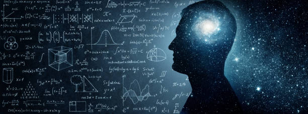 The universe within. Silhouette of a man inside the universe, physical and mathematical formulas.. stock photo