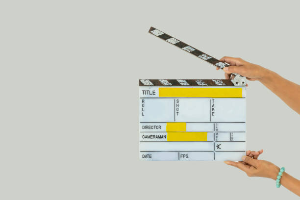The use of slate film in film production A clapperboard is a device used in filmmaking and video production to assist in synchronizing of picture and sound, and to designate and mark the various scenes and takes as they are filmed and audio-recorded. film script stock pictures, royalty-free photos & images