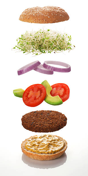 The various levels of a veggie burger Exploded view of a typical veggie burger, with sprouts, tomatoes, avocados, onions, grain mustard, hand made veggie patty, and a whole-grain Kaiser bun.
[url=file_closeup.php?id=8259777][img]file_thumbview_approve.php?size=1&amp;id=8259777[/img][/url] digital composite stock pictures, royalty-free photos & images
