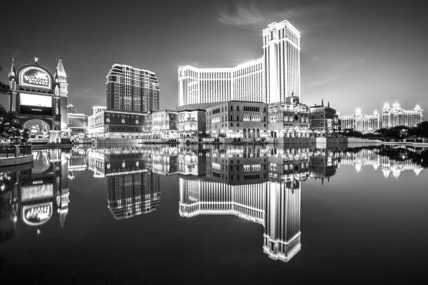 The Venetian Casino Macau, China - December 8, 2016: iconic The Venetian Macao reflecting on the lake, the largest casino in the world and the largest single structure hotel building in Asia. Black and white shot. the venetian macao stock pictures, royalty-free photos & images