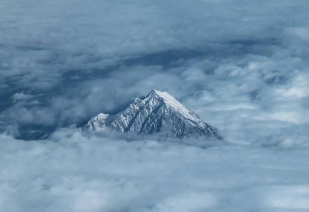 The view from the aircraft to the top of Mount Olympus in Greece among the clouds The view from the aircraft to the top of Mount Olympus in Greece among the clouds mt olympus stock pictures, royalty-free photos & images